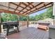 Outdoor deck with grill and trees in the background at 250 Stallsworth Rd, Mcdonough, GA 30252