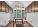 Cozy dining area featuring a round table, wood floors, and natural light from the bay window at 250 Stallsworth Rd, Mcdonough, GA 30252