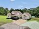 Wide view of the home exterior with the driveway, yard, and pool at 250 Stallsworth Rd, Mcdonough, GA 30252