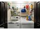 Functional laundry room equipped with a washing machine and dryer with shelving at 250 Stallsworth Rd, Mcdonough, GA 30252
