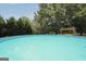 An inviting in-ground pool features a clean and refreshing space for summer fun and relaxation at 250 Stallsworth Rd, Mcdonough, GA 30252