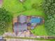 Aerial view of the home with an inground swimming pool surrounded by trees at 5436 Ahyoka Dr, Morrow, GA 30260