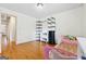 Cozy bedroom featuring hardwood floors, bright window, and easy closet access at 5436 Ahyoka Dr, Morrow, GA 30260