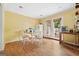 Sunny dining room with hardwood floors, table with chairs, and French doors to the outside at 5436 Ahyoka Dr, Morrow, GA 30260