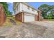 View of the house showing a driveway with a spacious two car garage at 5436 Ahyoka Dr, Morrow, GA 30260