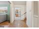 Welcoming hallway view leading to kitchen, featuring charming tile flooring and staircase access at 5436 Ahyoka Dr, Morrow, GA 30260