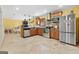 Spacious kitchen featuring stainless steel appliances, granite countertops, and tile flooring at 5436 Ahyoka Dr, Morrow, GA 30260
