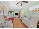 Bright living room with hardwood floors, soft-colored walls, and comfortable seating at 5436 Ahyoka Dr, Morrow, GA 30260