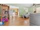Open living room showcasing hardwood floors, large windows, and seamless flow at 5436 Ahyoka Dr, Morrow, GA 30260