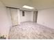 Finished basement area featuring modern flooring and access to other rooms at 2325 Lochinver Sw Ln, Conyers, GA 30094