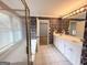 Bathroom features large mirror, shower, and garden tub at 2325 Lochinver Sw Ln, Conyers, GA 30094