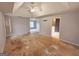 Spacious bedroom with tray ceiling and attached bathroom at 2325 Lochinver Sw Ln, Conyers, GA 30094