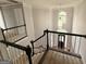 Bright foyer features an elegant chandelier and staircase at 2325 Lochinver Sw Ln, Conyers, GA 30094
