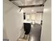 Compact basement kitchen area with sink and appliance hookups, offering renovation possibilities at 2325 Lochinver Sw Ln, Conyers, GA 30094