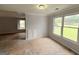Living room has built-in cabinets and large windows at 2325 Lochinver Sw Ln, Conyers, GA 30094