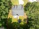 Aerial view of home with a large backyard, deck, trampoline, and playground at 2565 Aaron Ct, Loganville, GA 30052