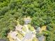 Aerial view of a home in a cul-de-sac, set among lush trees in a residential neighborhood at 2565 Aaron Ct, Loganville, GA 30052