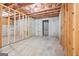 Spacious unfinished basement with exposed framing, concrete walls, and concrete flooring at 2565 Aaron Ct, Loganville, GA 30052