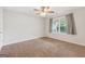 Bedroom featuring neutral walls, carpet flooring, and a ceiling fan with lighting at 2565 Aaron Ct, Loganville, GA 30052