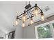 A modern chandelier hangs in the kitchen at 2565 Aaron Ct, Loganville, GA 30052