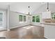 Bright dining area with hardwood floors and ample natural light from large windows at 2565 Aaron Ct, Loganville, GA 30052