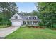 Charming single-Gathering home with a well-manicured lawn and attached two-car garage at 2565 Aaron Ct, Loganville, GA 30052