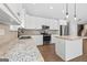 Close up of modern kitchen with white cabinets, granite countertops, and stainless steel appliances at 2565 Aaron Ct, Loganville, GA 30052