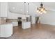 Modern kitchen with white cabinets, granite countertops, stainless appliances, and a kitchen island at 2565 Aaron Ct, Loganville, GA 30052