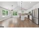 Spacious kitchen with white cabinets, stainless steel appliances, and a central island at 2565 Aaron Ct, Loganville, GA 30052