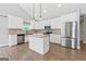 Bright kitchen with white cabinets, stainless steel appliances, and a central island at 2565 Aaron Ct, Loganville, GA 30052