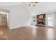 Bright living room with a vaulted ceiling, stone fireplace, and convenient access to the outdoors at 2565 Aaron Ct, Loganville, GA 30052