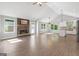 Bright, open-concept living area with a stone fireplace and a seamless flow to the modern kitchen at 2565 Aaron Ct, Loganville, GA 30052