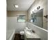 Bathroom featuring new vanity, modern lighting and a window bringing in lots of light at 4385 Midway Rd, Douglasville, GA 30134