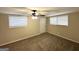 Neutral bedroom with blinds and ceiling fan with an entrance leading to outside at 4385 Midway Rd, Douglasville, GA 30134