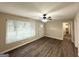 Bright living room with large windows, new floors and freshly painted walls at 4385 Midway Rd, Douglasville, GA 30134