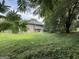 Large backyard featuring a two story home with a covered back porch at 5156 Allison Way, Sugar Hill, GA 30518