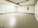 Unfinished basement space with two doors and sealed concrete floor at 5156 Allison Way, Sugar Hill, GA 30518