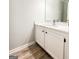 Updated bathroom with a white vanity, modern fixtures and flooring at 5156 Allison Way, Sugar Hill, GA 30518