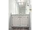 Small bathroom featuring a white single sink vanity with cabinet storage at 5156 Allison Way, Sugar Hill, GA 30518
