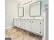 Bathroom featuring double sinks, granite countertops, and modern fixtures at 5156 Allison Way, Sugar Hill, GA 30518