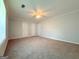 Large, bright bedroom with tan carpet and three white doors at 5156 Allison Way, Sugar Hill, GA 30518