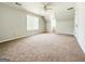 Spacious bedroom with ample natural light from multiple windows and a ceiling fan at 5156 Allison Way, Sugar Hill, GA 30518