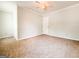 Carpeted bedroom featuring a ceiling fan, neutral walls and natural light at 5156 Allison Way, Sugar Hill, GA 30518