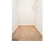 View of closet space with carpeted floor and white shelving unit at 5156 Allison Way, Sugar Hill, GA 30518