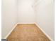 View of closet space with carpeted floor and white shelving unit at 5156 Allison Way, Sugar Hill, GA 30518