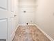 Inside utility room with neutral walls and vinyl flooring at 5156 Allison Way, Sugar Hill, GA 30518