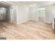 Bright and airy living room with fresh paint and beautiful, modern flooring at 5156 Allison Way, Sugar Hill, GA 30518