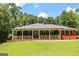 Lovely single-story red brick home with a large, inviting, covered front porch, perfect for relaxing at 543 Wynn Rd, Mcdonough, GA 30252