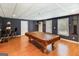Basement game room featuring a pool table, hardwood floors, and stylish lighting under a drop ceiling at 543 Wynn Rd, Mcdonough, GA 30252