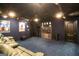 Home theater room with dark blue walls, a large screen, recliner couches and a ceiling fan for added comfort at 543 Wynn Rd, Mcdonough, GA 30252
